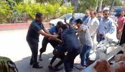Video कैबिनेट मंत्री के सामने युवक की जमकर धुनाई, जानिए क्या है पूरा मामला